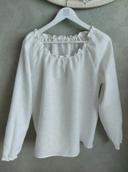 Long sleeved linen blouse with ruffles